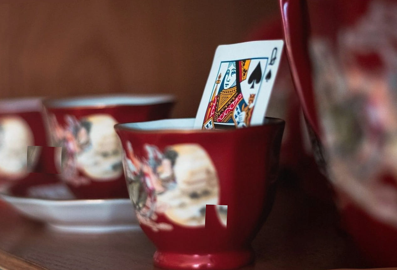 A host explaining the next step to players at a card table